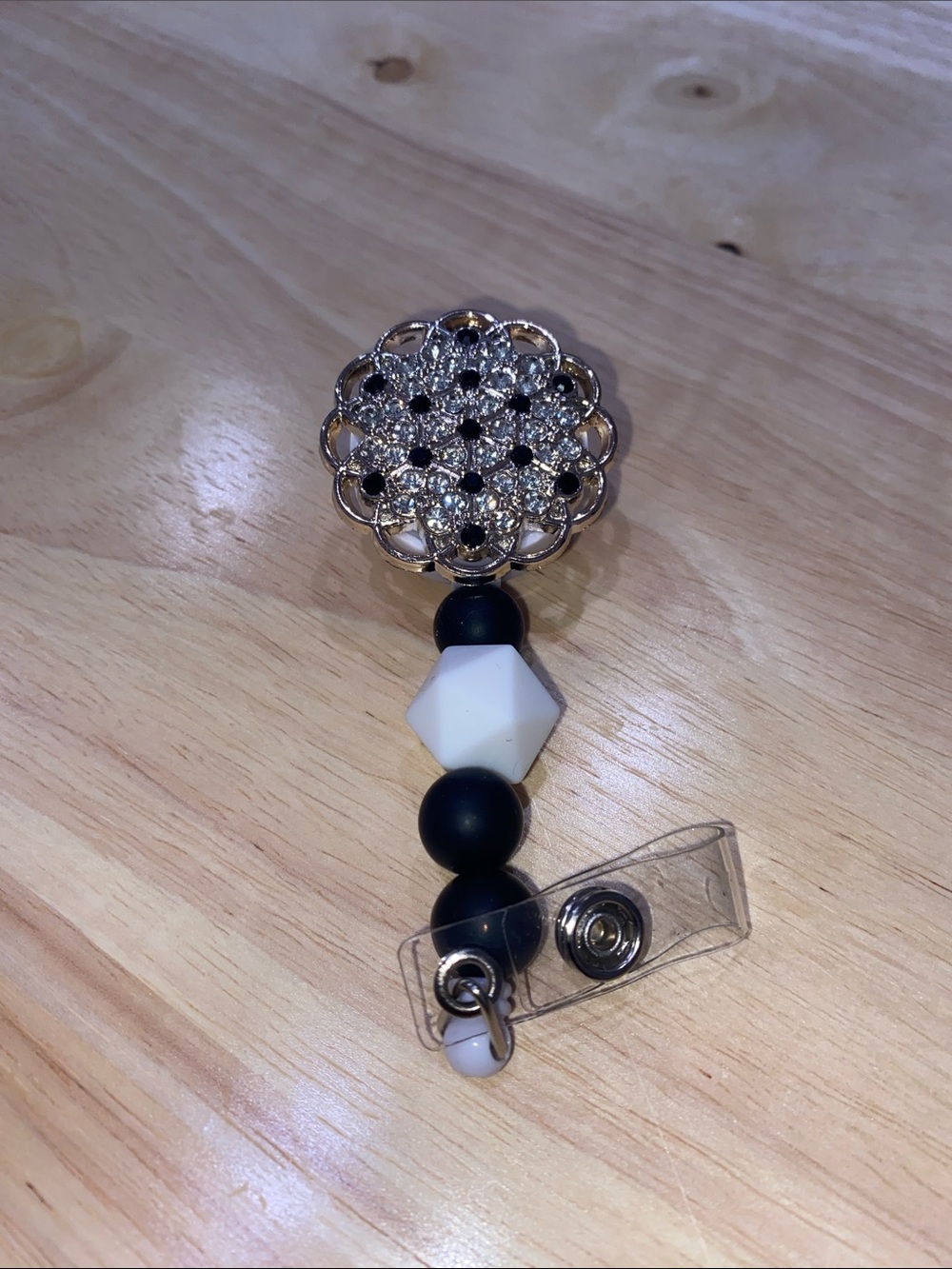 Rhinestone Flower Badge Reel with Black & White Beads